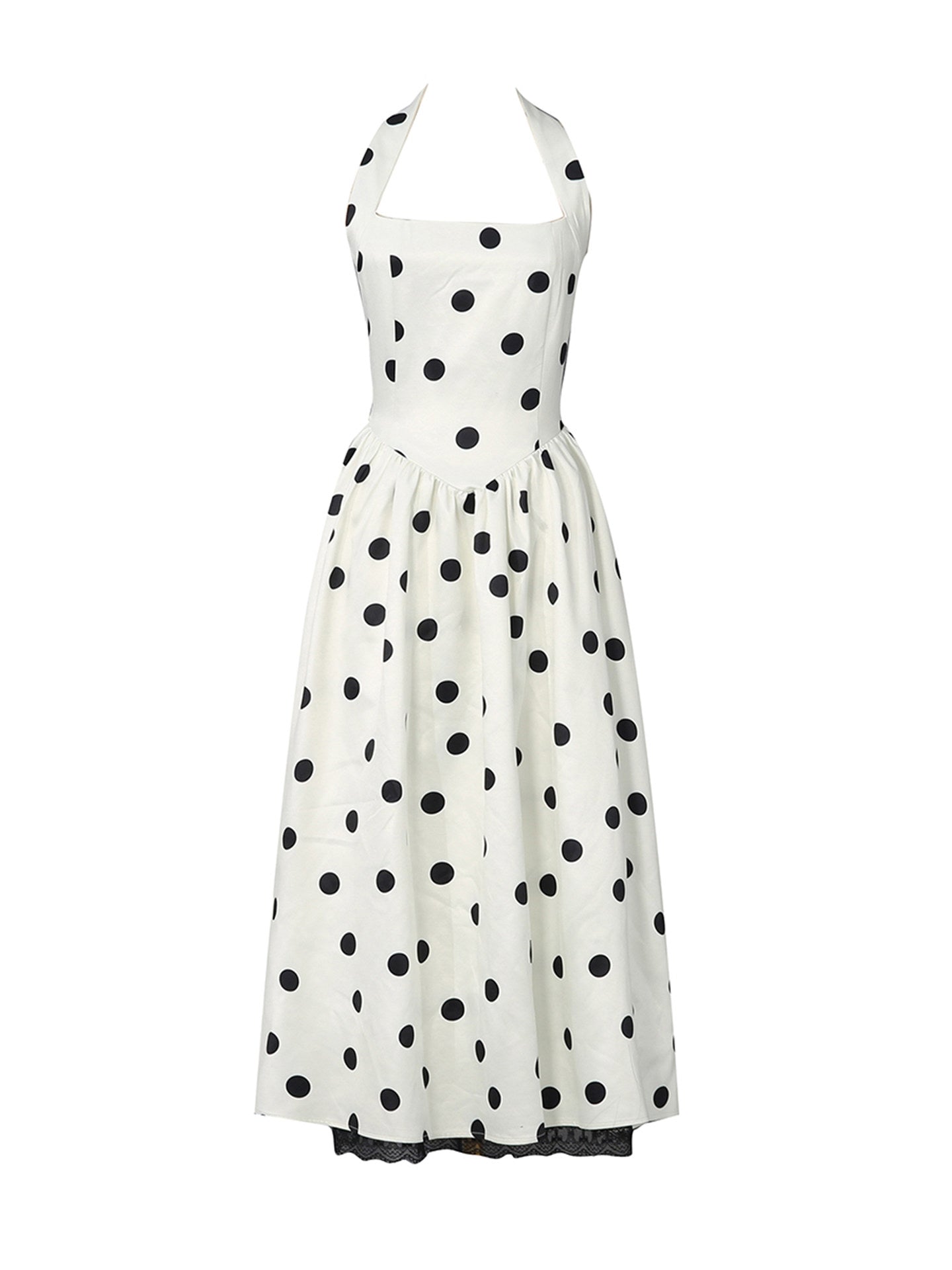 A white halter-neck dress with a black polka dot pattern, shown against a plain white background.