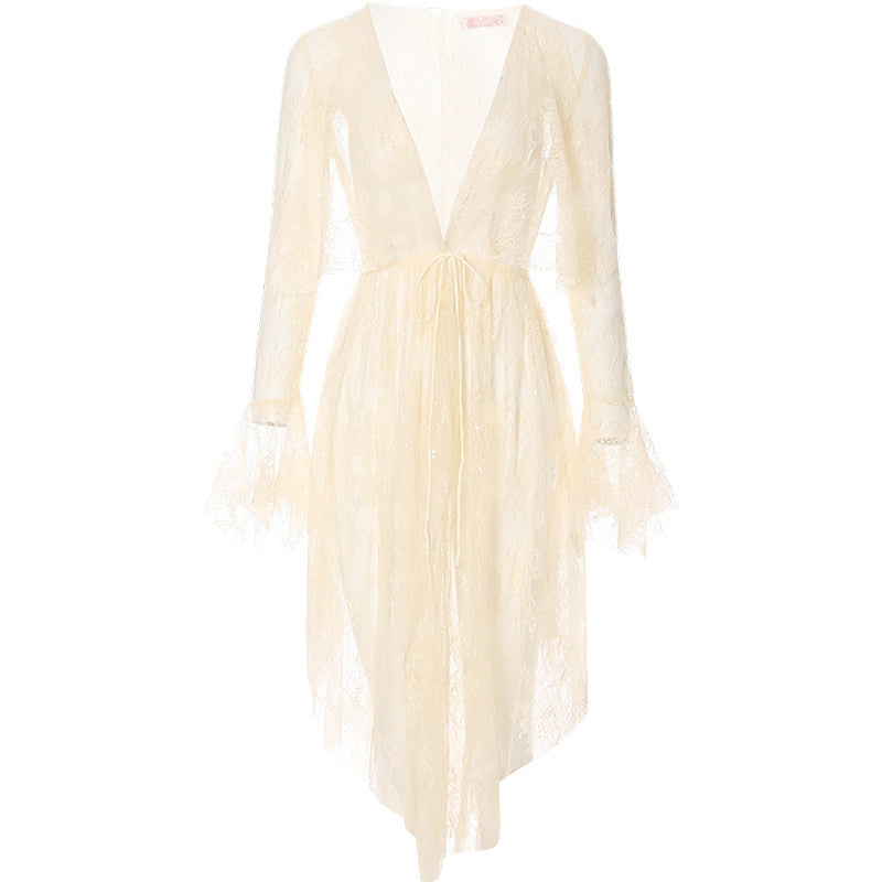 Cream-colored dress with long sleeves on a white background