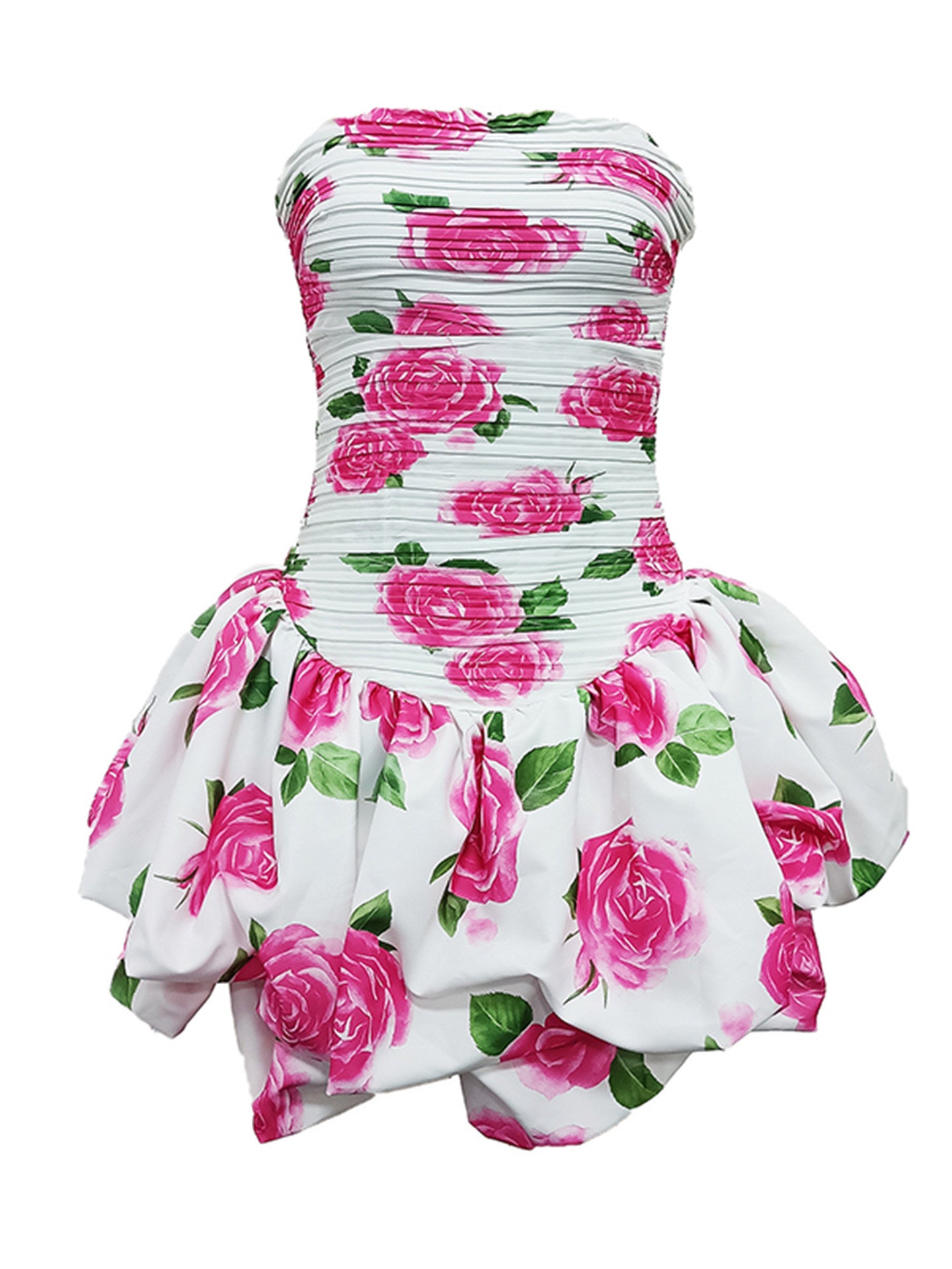 A strapless white dress with a pleated bodice and a ruffled peplum skirt, featuring a vibrant pink rose and green leaf pattern, shown against a plain white background.