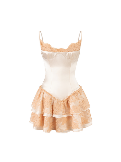 A short camisole-style lingerie dress with a smooth ivory satin bodice and layered ruffled peach-beige lace skirt, shown on a plain white background.