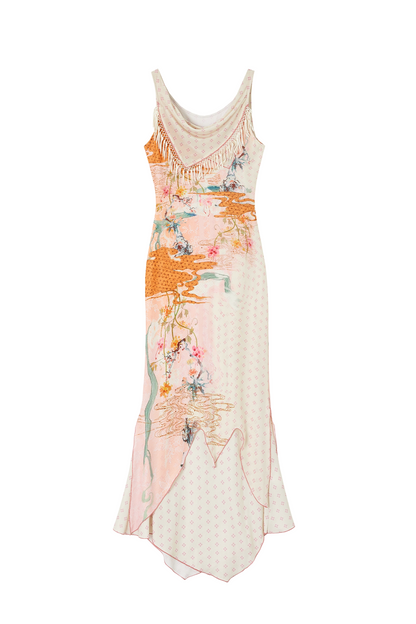 A sleeveless, asymmetrical midi dress in a soft cream and light pink colorway, decorated with an orange and teal abstract floral print and delicate fringe along the neckline, shown against a plain white background.
