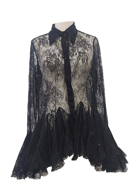 A black sheer lace long-sleeve blouse with a pointed collar, button front, and a layered ruffled tulle hem, displayed on a mannequin torso against a plain white background.