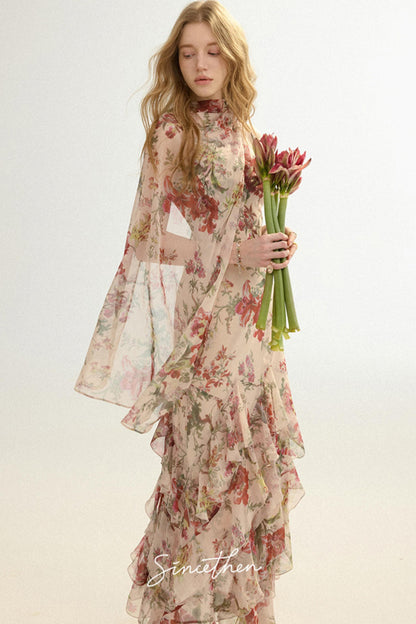 Woman wearing a floral dress holding flowers against a white background