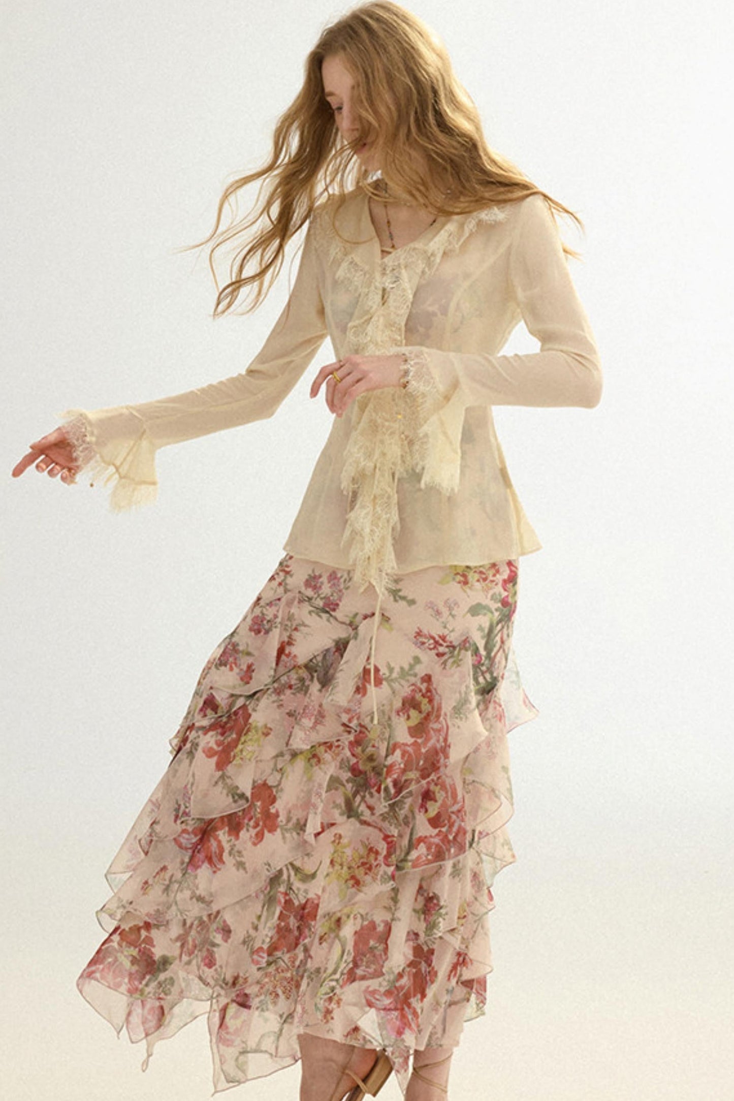 Woman wearing a floral dress with a plain background