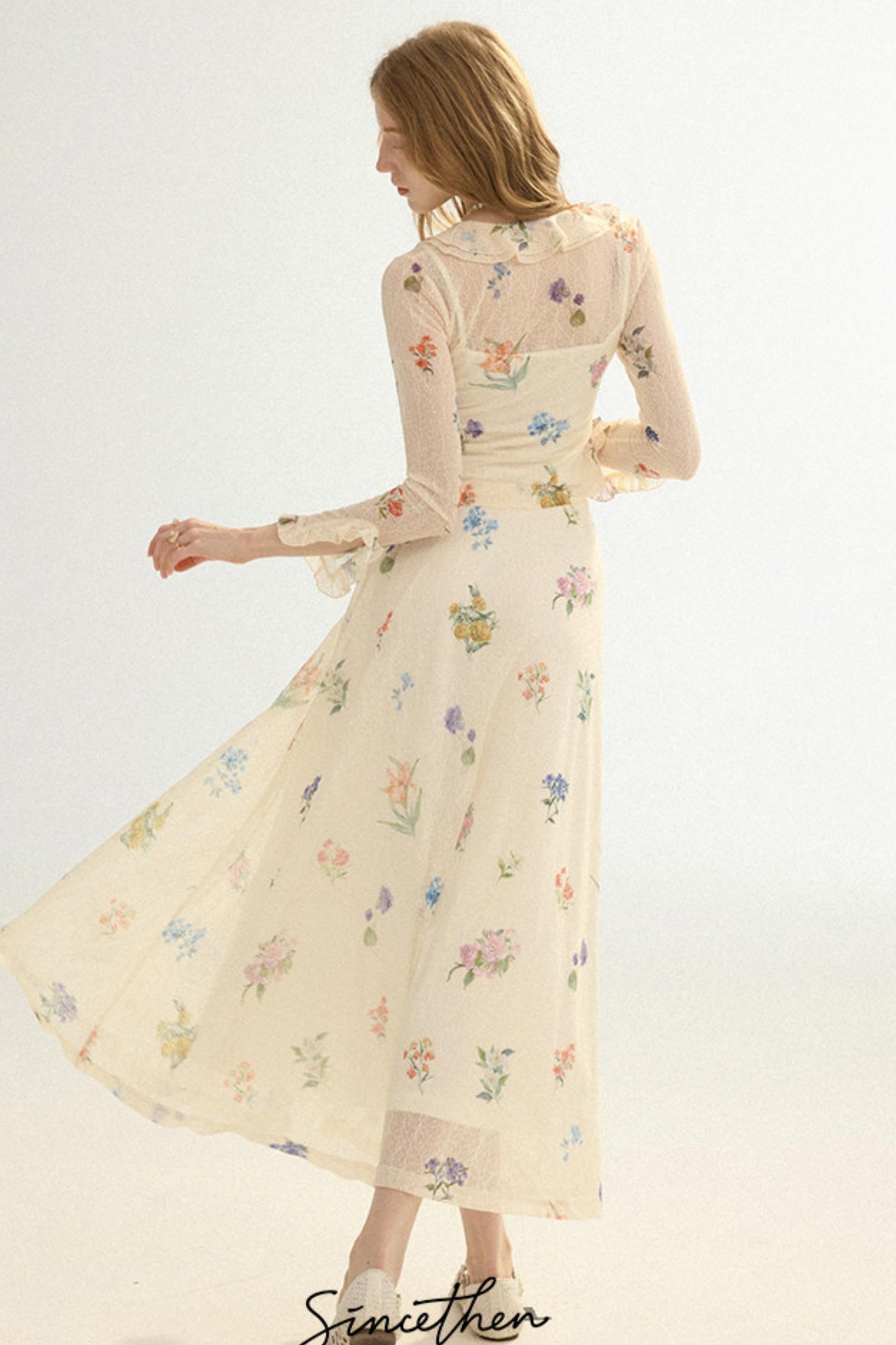 Woman wearing a floral dress on a white background
