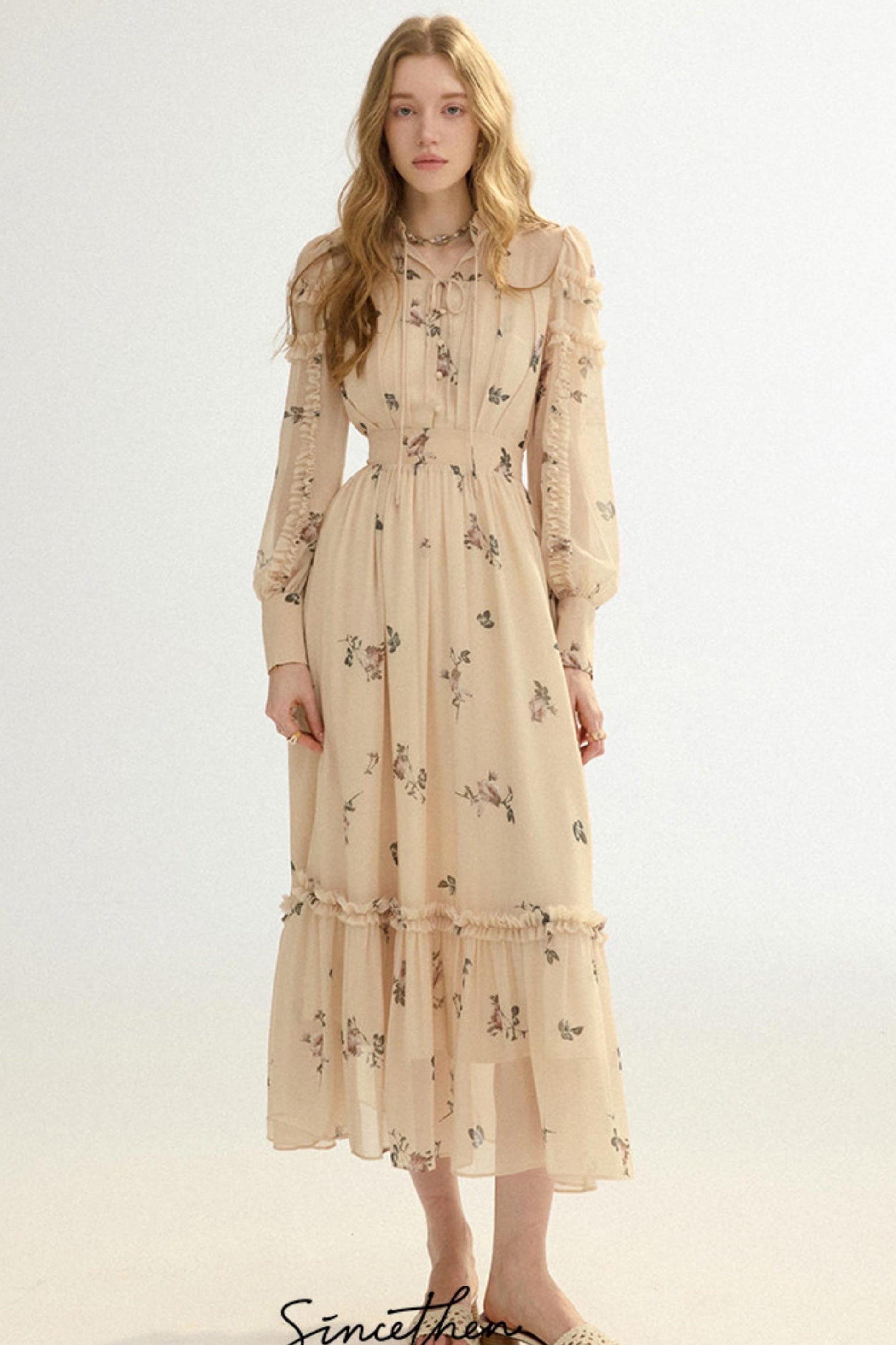 Woman wearing a beige floral dress on a white background