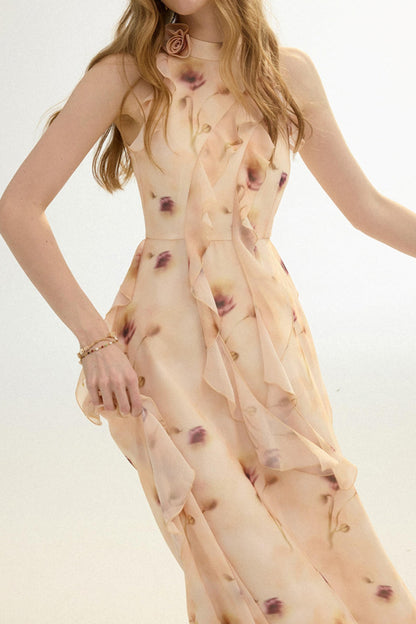 Woman wearing a sheer beige dress with red floral patterns on a light background