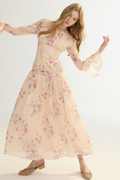Woman wearing a floral dress against a white background