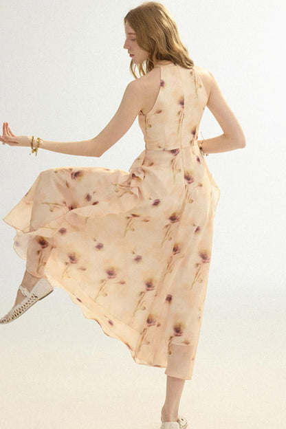 Woman in a flowing dress on a plain background