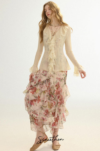 Woman wearing a floral dress and beige top on a white background