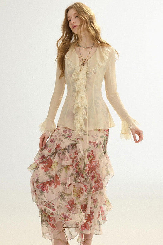 Woman wearing a floral dress and beige top on a white background