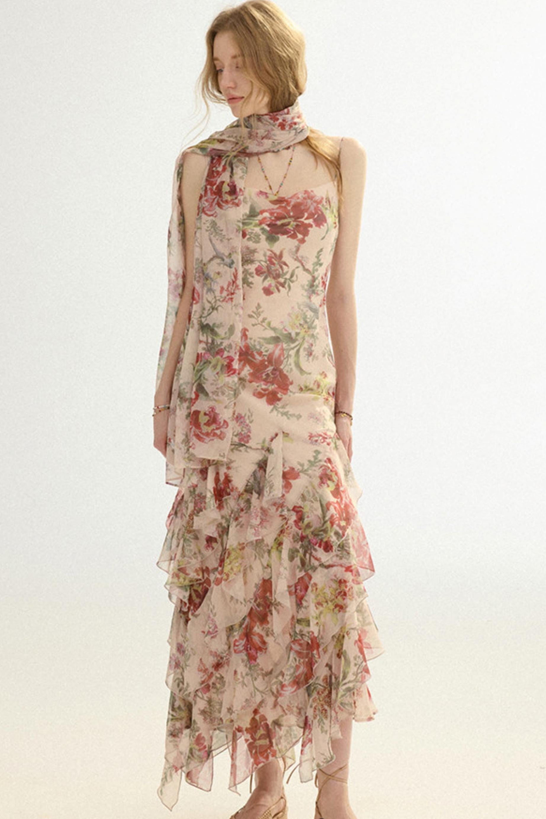 Woman wearing a floral dress with a plain background