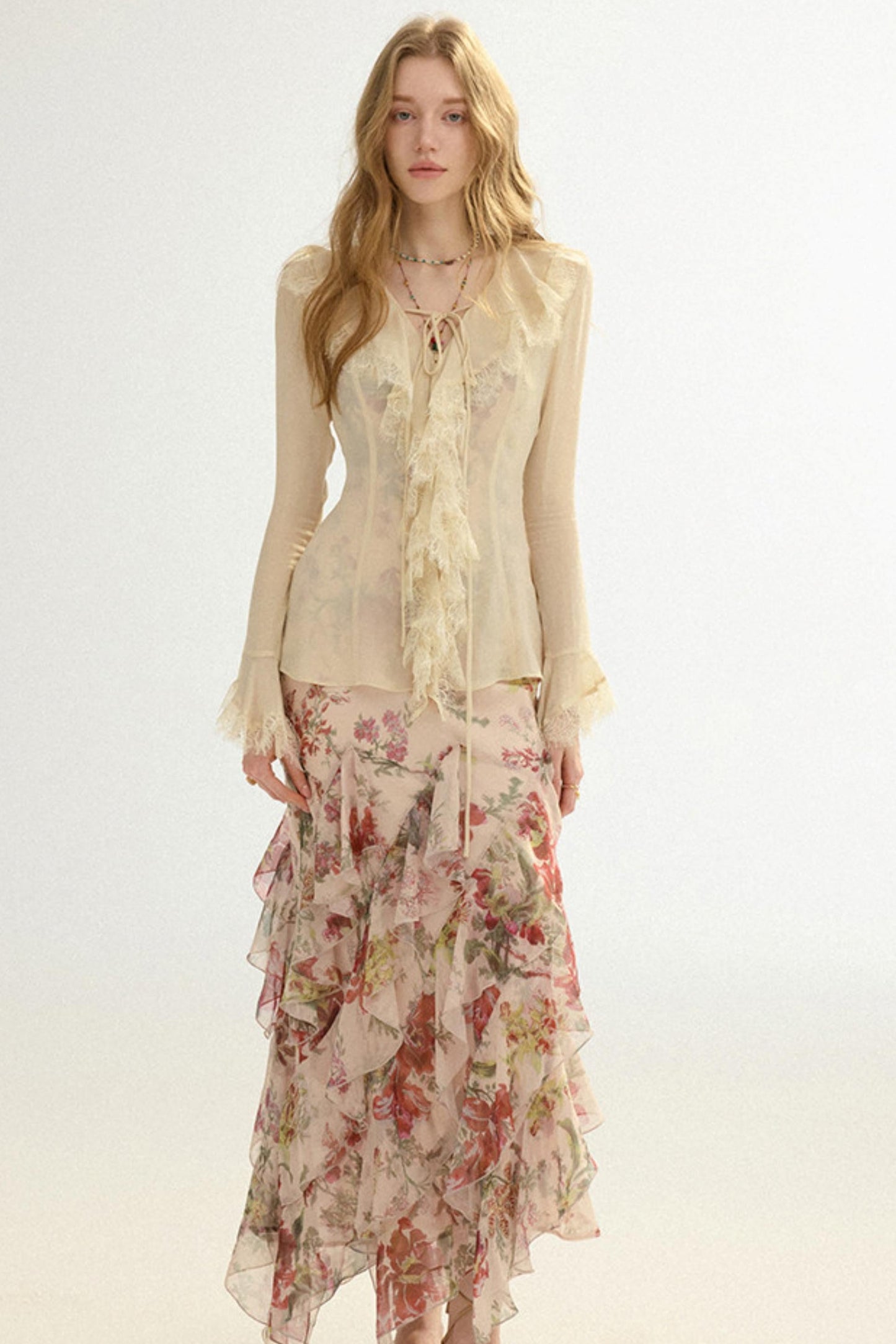 Woman wearing a floral dress with a plain background