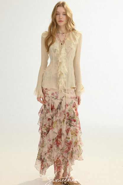 Woman wearing a floral dress with a sheer top on a white background