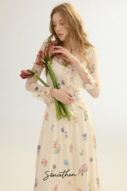 Woman in a floral dress holding flowers against a white background