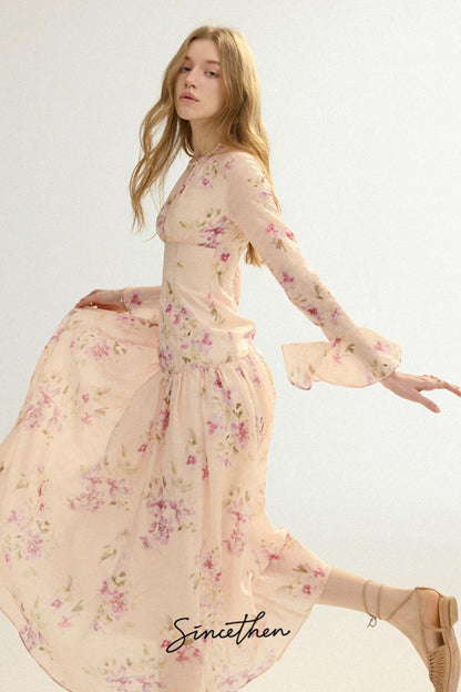 Woman wearing a floral dress with a plain background