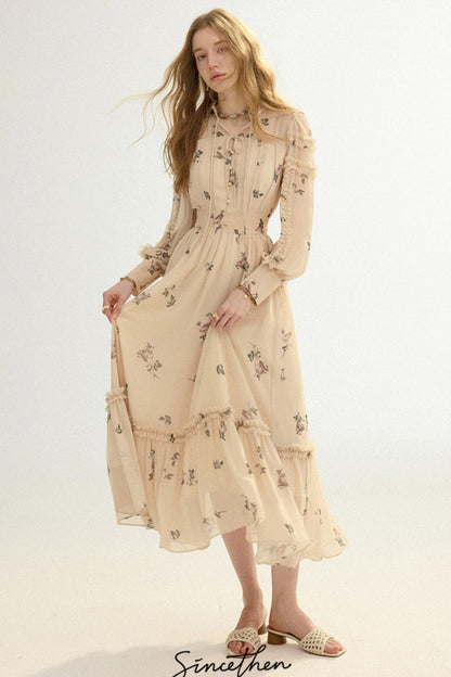 Woman wearing a beige floral dress on a white background