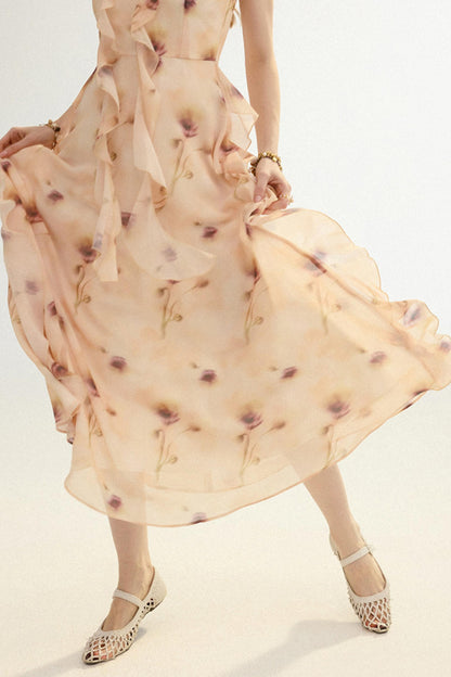 Woman wearing a beige floral dress with a plain background
