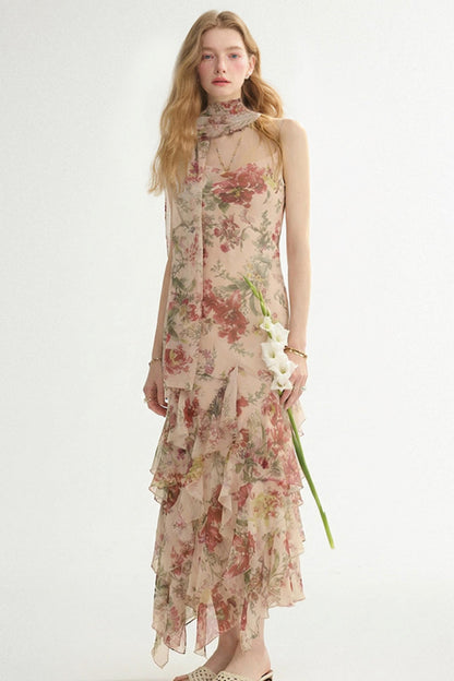Woman wearing a floral dress holding a flower on a white background